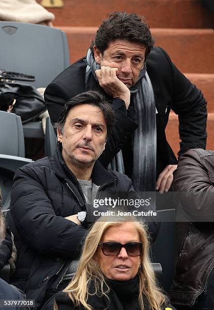 Patrick Bruel, below him Yvan Attal attend day 13 of the 2016 French Open held at Roland-Garros stadium on June 3, 2016 in Paris, France.