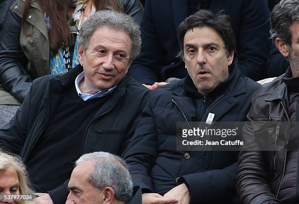 Michel Drucker and Yvan Attal attend day 13 of the 2016 French Open held at Roland-Garros stadium on June 3, 2016 in Paris, France.