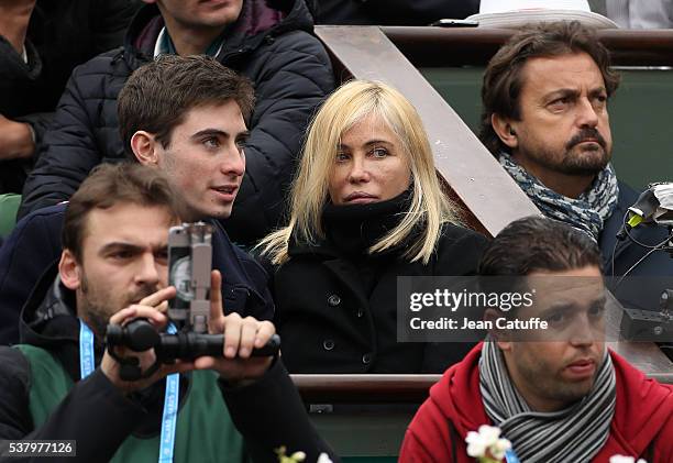 Emmanuelle Beart, her son Yohann Moreau and EuroSport consultant Henri Leconte attend day 13 of the 2016 French Open held at Roland-Garros stadium on...