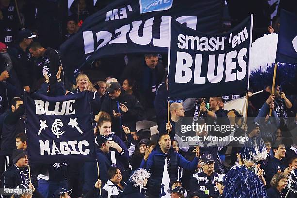 Blues fans celebrate a goal during the round 11 AFL match between the Carlton Blues and the Brisbane Lions at Etihad Stadium on June 4, 2016 in...