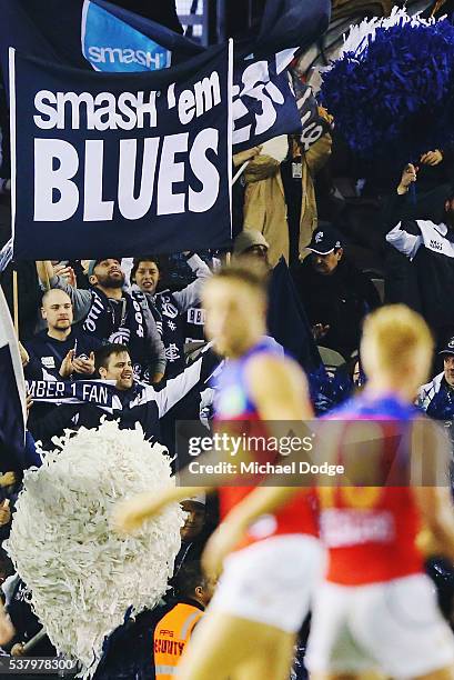 Blues fans celebrate a goal during the round 11 AFL match between the Carlton Blues and the Brisbane Lions at Etihad Stadium on June 4, 2016 in...