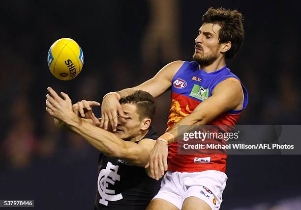 Andrejs Everitt of the Blues and Sam Mayes of the Lions compete for the ball during the 2016 AFL Round 11 match between the Carlton Blues and the...