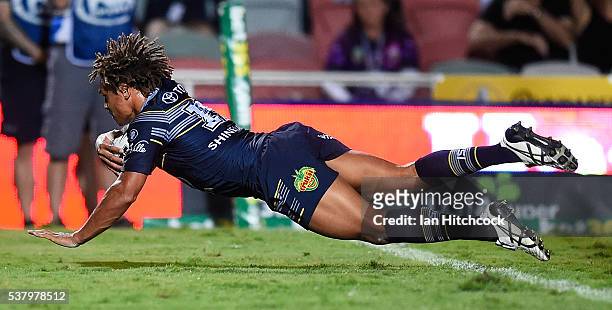 Ray Thompson of the Cowboys scores a try during the round 13 NRL match between the North Queensland Cowboys and the Newcastle Knights at 1300SMILES...