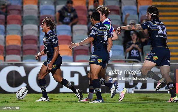 Ray Thompson of the Cowboys celebrates after scoring a try during the round 13 NRL match between the North Queensland Cowboys and the Newcastle...