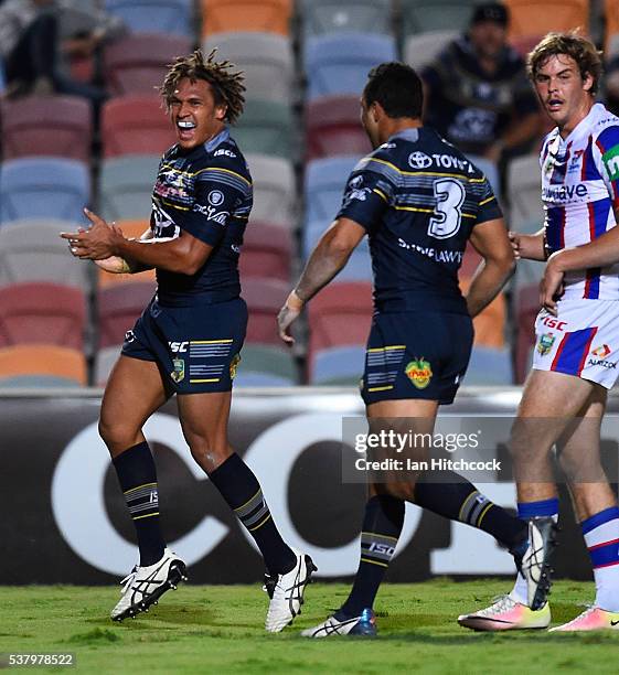 Ray Thompson of the Cowboys celebrates after scoring a try during the round 13 NRL match between the North Queensland Cowboys and the Newcastle...