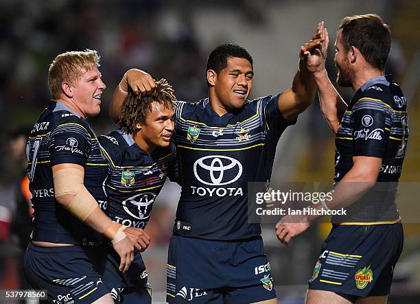 Ray Thompson of the Cowboys celebrates after scoring a try with Ben Hannant, Gavin Cooper and John Asiata of the Cowboys during the round 13 NRL...