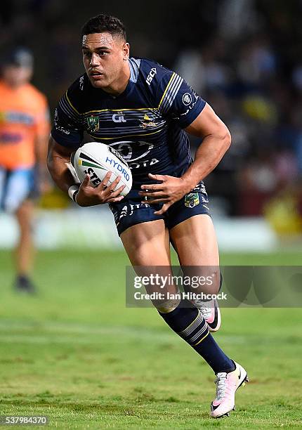 Antonio Winterstein of the Cowboys runs the ball during the round 13 NRL match between the North Queensland Cowboys and the Newcastle Knights at...