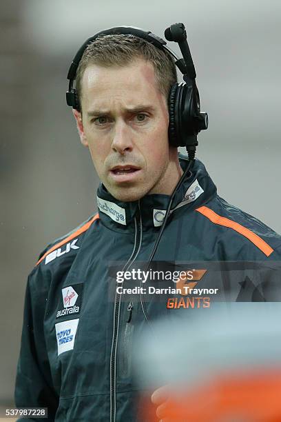 Former Collingwood captain Nick Maxwell looks on from the Giants bench during the round 11 AFL match between the Geelong Cats and the Greater Western...