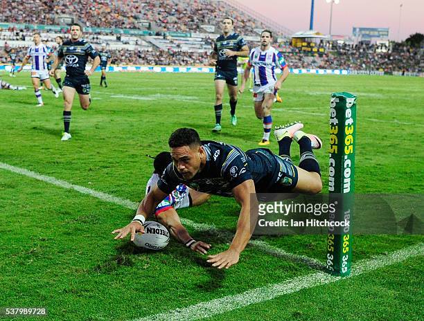 Antonio Winterstein of the Cowboys scores a try during the round 13 NRL match between the North Queensland Cowboys and the Newcastle Knights at...