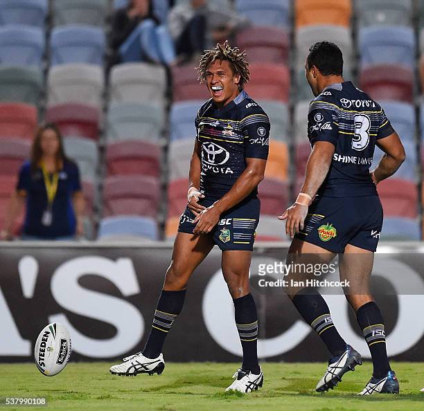 Ray Thompson of the Cowboys celebrates after scoring a try during the round 13 NRL match between the North Queensland Cowboys and the Newcastle...