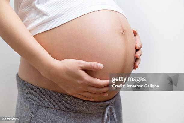 Belly Of A Pregnant Woman High-Res Stock Photo