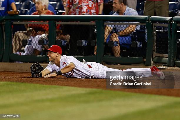 David Lough of the Philadelphia Phillies smiles after catching a foul ball hit by Jayson Werth of the Washington Nationals in the seventh inning of...