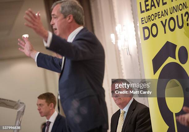 Former Defence Secretary Liam Fox listens as UKIP leader Nigel Farage speaks at a Grassroots Out! campaign rally at the Mercure Bristol Grand Hotel...