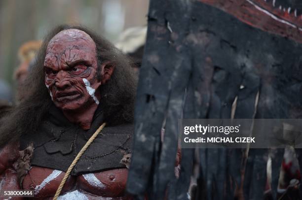 Fan dressed as a character from The Hobbit book, marches through the forest near the village of Doksy, some 80 km from Prague, on June 4, 2016. - The...