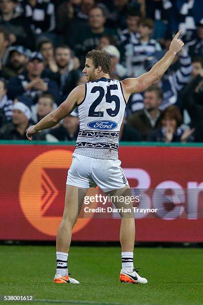 Lachie Henderson of the Cats celebrates a goal during the round 11 AFL match between the Geelong Cats and the Greater Western Sydney Giants at...