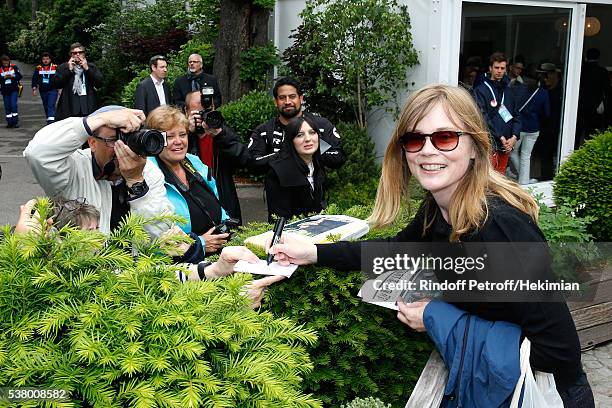 Actress Isabelle Carre signs autographs during Day Fourteen, Women single's Final of the 2016 French Tennis Open at Roland Garros on June 4, 2016 in...