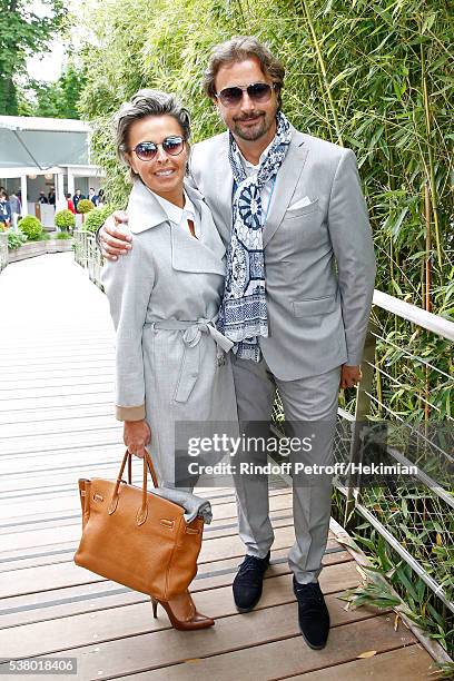 Henri Leconte and Maria Dowlatshahi attend Day Fourteen, Women single's Final of the 2016 French Tennis Open at Roland Garros on June 4, 2016 in...