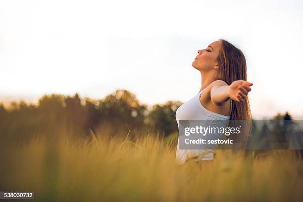 enjoying the sunlight - spiritual healing stock pictures, royalty-free photos & images