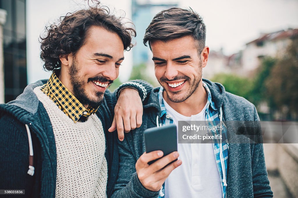 Two guys with smart phone