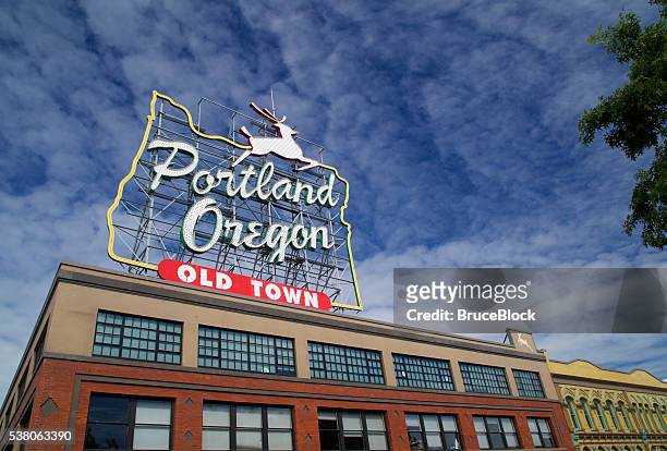 portland oregon landmark stag sign in old town - portland neon sign stock pictures, royalty-free photos & images
