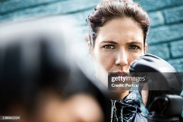 determined athlete boxing against wall - punching wall stock pictures, royalty-free photos & images