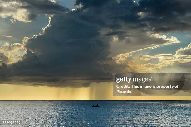 rainy and complicated day - curacao fotografías e imágenes de stock