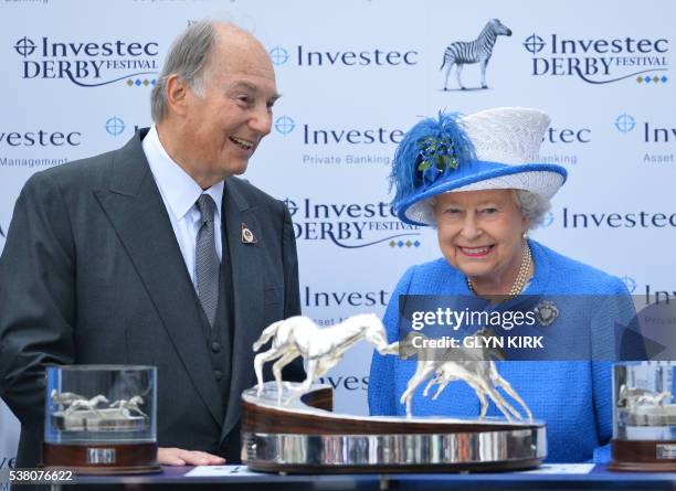 Britain's Queen Elizabeth II speaks with the Aga Khan after his horse Harzand won the Derby on the second day of the Epsom Derby Festival in Surrey,...