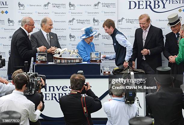 Global Managing Director of Investec Bernard Kantor, His Highness The Aga Khan, Queen Elizabeth II, groomer Patrick Murray, horse trainer Dermot...