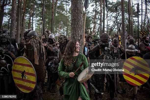 Participants dressed as characters from 'The Hobbit' book by J. R. R. Tolkien take part in the reenactment of the 'Battle of Five Armies' in a forest...