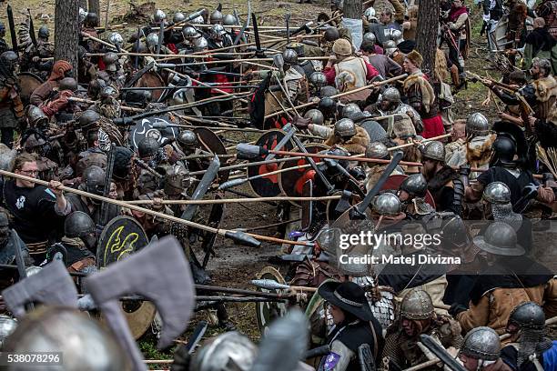 Participants dressed as characters from 'The Hobbit' book by J. R. R. Tolkien take part in the reenactment of the 'Battle of Five Armies' in a forest...