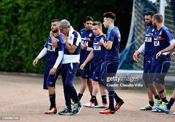 Lorenzo Insigne of Italy chat with the Italy doctor's Enrico Castellacci prior to the Italy training session at the club's training ground at...