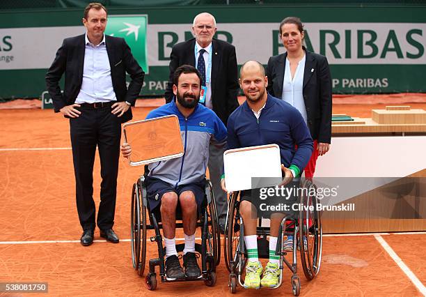 Runners up Michael Jeremiasz of France and Stefan Olsson of Sweden pose with the trophies won in the Men's Wheelchair doubles final match against...