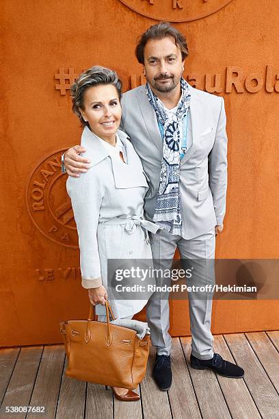 Henri Leconte and his wife Maria Dowlatshahi attend the French Tennis Open Day Fourteen at Roland Garros on June 4, 2016 in Paris, France.