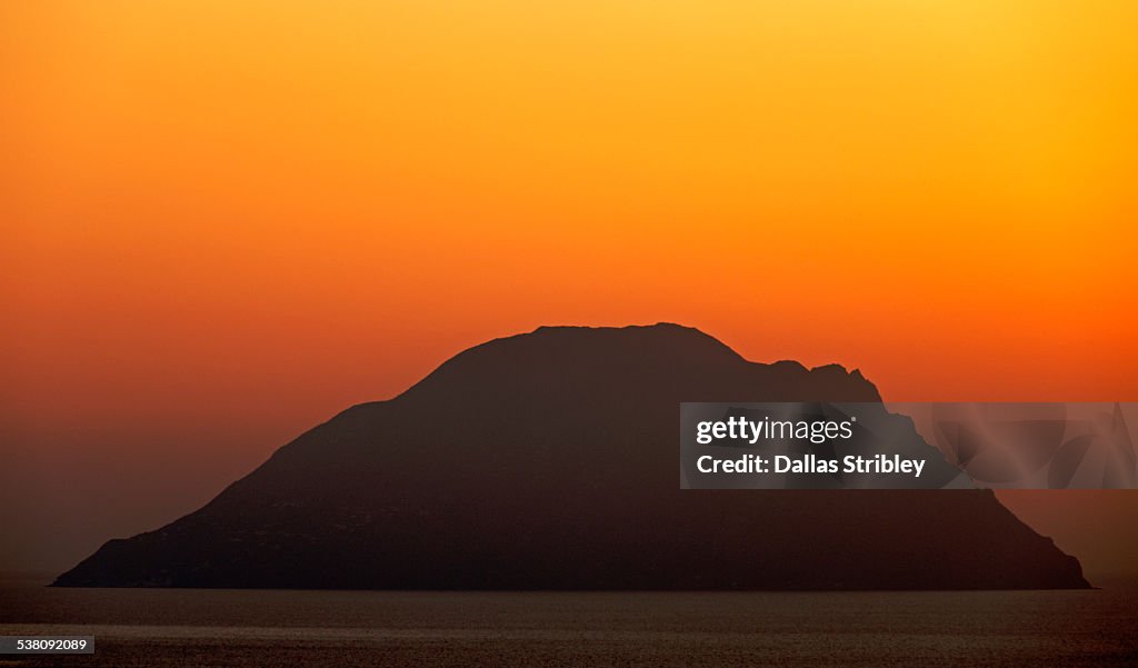 Sunset silhouette of the island of Alicudi, Sicily