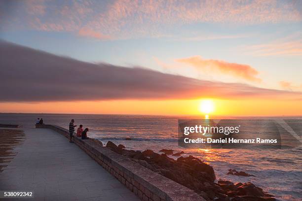 sunset at the sea. baiona. galicia - guarda sol stock pictures, royalty-free photos & images