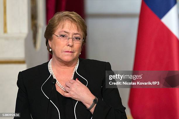 Invited by the French President Francois Hollande, the President of Chile Michelle Bachelet, speaks during a press conference on the occasion of the...