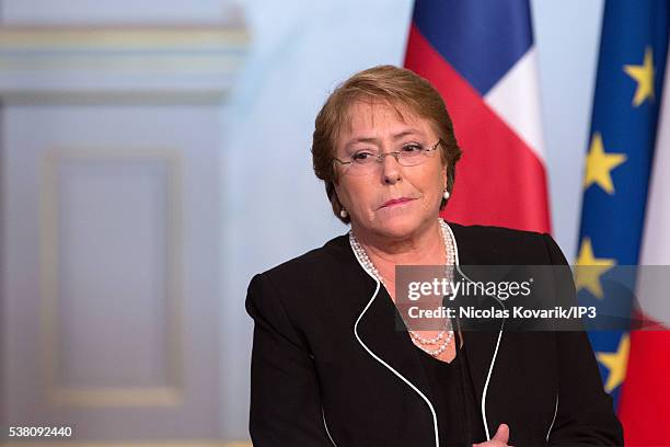 Invited by the French President Francois Hollande, the President of Chile Michelle Bachelet, speaks during a press conference on the occasion of the...