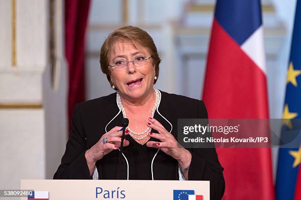 Invited by the French President Francois Hollande, the President of Chile Michelle Bachelet, speaks during a press conference on the occasion of the...