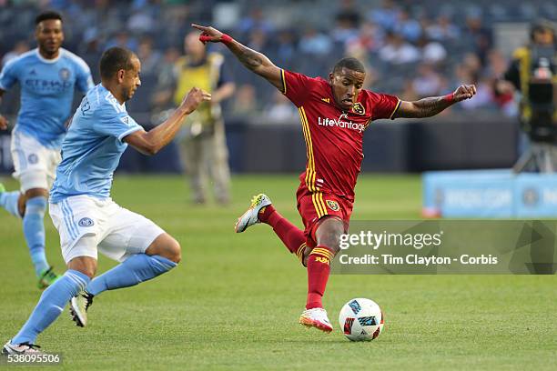 June 02: Joao Plata of Real Salt Lake gets to the ball ahead of Jason Hernandez of New York City FC during the NYCFC Vs Real Salt Lake regular season...