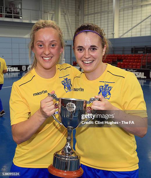 Louise Fensome and Lorea Sarobe of the University of Gloucestershire team celebrate with the trophy after winning the Women's FA Futsal Cup Finals at...
