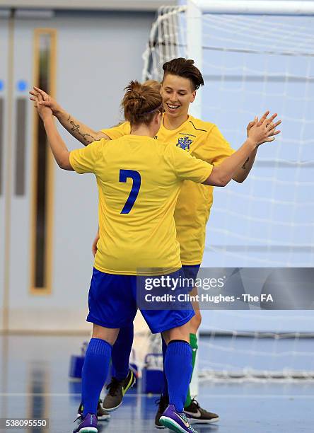 Paige Stewart of University of Gloucestershire celebrates with team-mate Lorea Sarobe after she scores her sides third goal during the Women's FA...