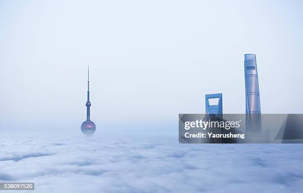 top shanghai building in cloud sea - prosperity stock pictures, royalty-free photos & images