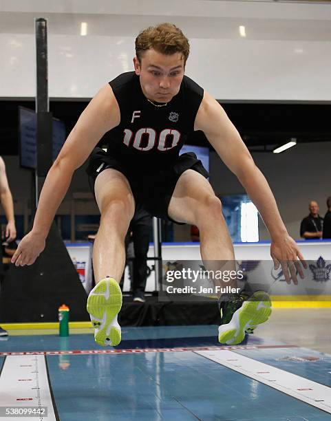 Kieffer Bellows does the Long jump during the NHL Combine at HarborCenter on June 4, 2016 in Buffalo, New York.