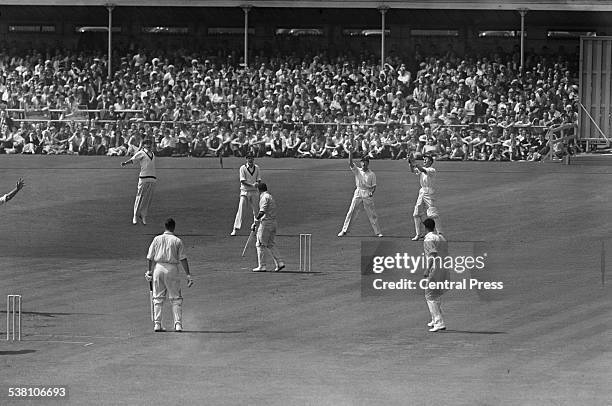 England batsman Don Kenyon after being caught out by South African wicket keeper John Waite on the fourth day of the third Test at Old Trafford,...