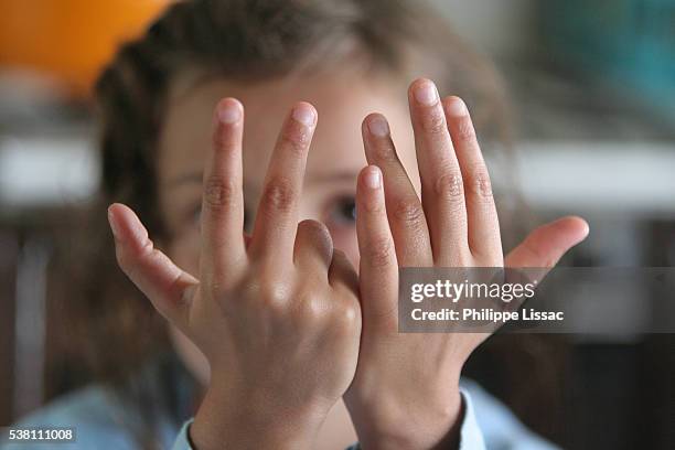girl counting on fingers - counting stock pictures, royalty-free photos & images