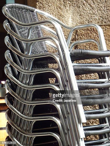 group of chairs stacked cafeteria terrace - stack of sun lounges stock pictures, royalty-free photos & images