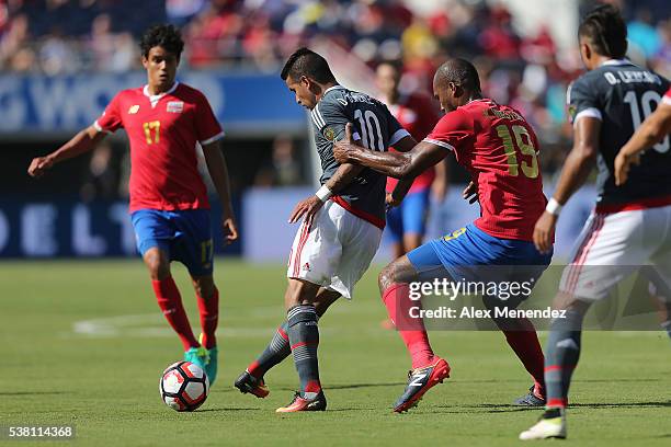 Kendall Watson of Costa Rica grabs Derlis Gonzalez of Paraguay during the 2016 Copa America Centenario Group A match between Costa Rica and Paraguay...