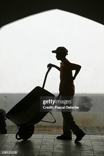 child working at a building site - child labour stock pictures, royalty-free photos & images