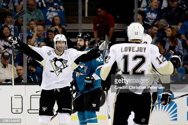 Ben Lovejoy of the Pittsburgh Penguins celebrates with Matt Cullen after scoring in the first period against the San Jose Sharks in Game Three of the...