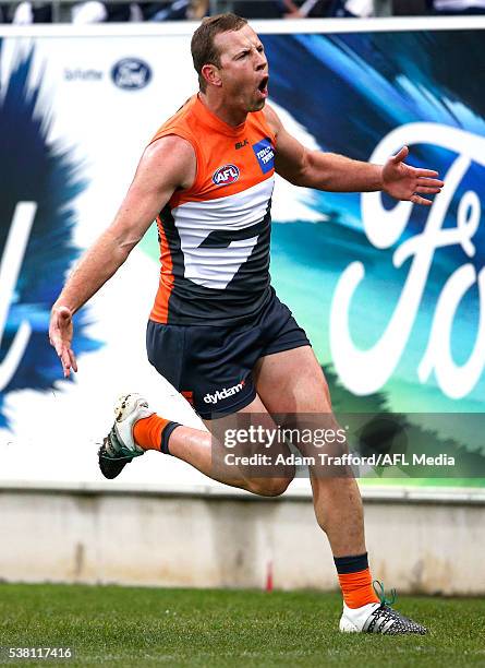 Steve Johnson of the Giants celebrates a goal during the 2016 AFL Round 11 match between the Geelong Cats and the GWS Giants at Simonds Stadium on...